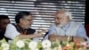 ভারতের প্রধানমন্ত্রী নরেন্দ্র মোদী এবং বিহারের প্রাক্তন উপ-মুখ্যমন্ত্রী, বিজেপির প্রবীণ নেতা সুশীল মোদী।
