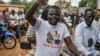 A protester wearing a T-shirt in support of the Niger, Mali, Guinea and Burkina Faso junta leaders gestures during a demonstration in Niamey, Niger, on Aug. 3, 2023. 