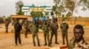 Members of Niger's security forces stand guard as pro-junta supporters take part in a demonstration in front of a French army base in Niamey, Aug. 11, 2023. The new U.S. ambassador to Niger, Kathleen FitzGibbon, will arrive in Niamey, the State Department said Aug. 16.
