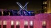 FILE - Workers install lighting on an "X" sign atop the company headquarters, formerly known as Twitter, in downtown San Francisco, July 28, 2023.