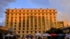 Media vehicles stage outside the Fulton County Courthouse, Atlanta, Aug. 14, 2023, in Atlanta. 