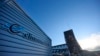 FILE - A Climeworks factory with its fans in front of the collector, drawing in ambient air and releasing it,as largely purified CO2 through ventilators at the back, is seen at the Hellisheidi power plant near Reykjavik, Iceland, on Oct. 11, 2021. 