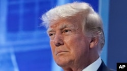 FILE - Former President Donald Trump arrives to speak at the Moms for Liberty meeting in Philadelphia, June 30, 2023.