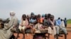 Sudanese children, who fled the conflict in Murnei in Sudan's Darfur region, ride a cart while crossing the border between Sudan and Chad in Adre, Chad, Aug. 4, 2023.