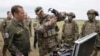 FILE - Russian Security Council Deputy Chairman Dmitry Medvedev, left, visits a military training ground in Volgograd, Russia, on June 1, 2023. The U.S. on Aug. 16, 2023, imposed sanctions on three entities it accused of being tied to arms deals between North Korea and Russia