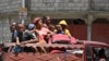 Residents evacuate the Carrefour Feuilles commune in Port-au-Prince, Haiti, on Aug. 15, 2023, as gang violence continues to plague the Haitian capital.