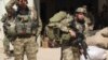 Afghan special forces arrive at the airport as they launch a counteroffensive to retake the city from Taliban insurgents, in Kunduz, Sept. 29, 2015. 