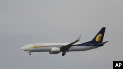 FILE - A passenger Airbus of India's Jet Airways prepares for a landing, April 16, 2015, at the Indira Gandhi International airport in New Delhi, India.