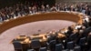 Members of the United Nations Security Council raise their hands as they vote unanimously to approve a resolution eradicating Syria's chemical arsenal at a Security Council meeting during the 68th United Nations General Assembly in New York, Sept. 27, 201