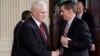 Vice President Mike Pence greets National Security Advisor Michael Flynn before Japanese Prime Minister Shinzo Abe and U.S. President Donald Trump arrive for their joint news conference at the White House in Washington, Feb. 10, 2017.
