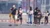 FILE - Tourists wear masks in Chiang Mai province, Thailand, April 2, 2019. The air hanging over Thailand's far north has become so polluted, the prime minister went Tuesday to see in person what's been called a severe health crisis.