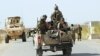 Afghan National Army soldiers arrive to start an operation, outside of Kunduz city, north of Kabul, Afghanistan, Sept. 30, 2015.