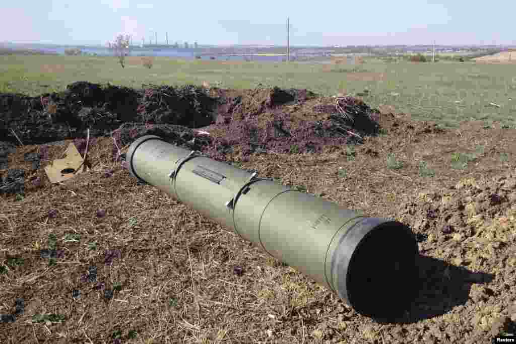A tube of a Russian-made Kornet anti-tank guided missile lies on a battlefield near Starobesheve in eastern Ukraine, Oct. 2, 2014.