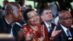 From Left: Mandla Mandela, grandson of former president Nelson Mandela, Graca Machel, wife of Mandela, and president Jacob Zuma attend the opening of the revamped Nelson Mandela Centre of Memory in Johannesburg, Nov. 18, 2013. 