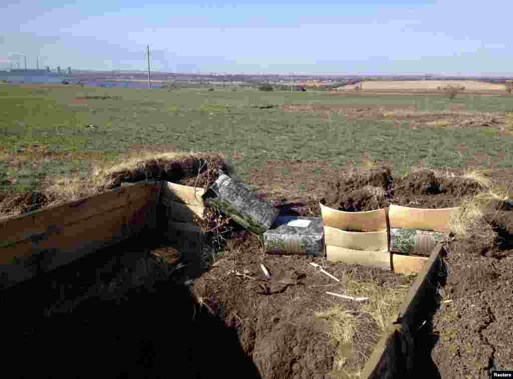 Used boxes of packed meals for the Russian army reinforce a blindage near Starobesheve, controlled by pro-Russian separatists, in eastern Ukraine, Oct. 2, 2014.