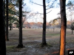 FILE - In this Dec. 29, 2016 photo, cottages are seen in the distance on the grounds of a riverfront compound near Centreville, Md., that has been used by Russian Federation diplomats for years.