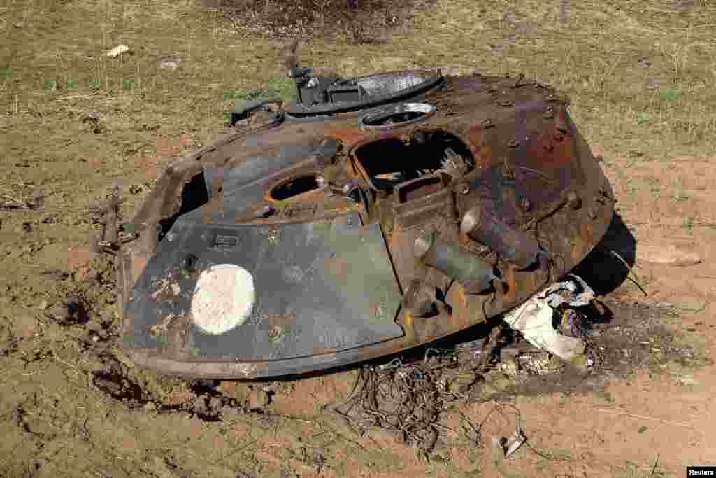 The turret of a Russian-made BMP-2 armored personnel carrier lies on a battlefield near Starobesheve, eastern Ukraine, Oct. 2, 2014.