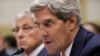 Secretary of State John Kerry, accompanied by Defense Secretary Chuck Hagel, left, testifies on Capitol Hill, Sept. 4, 2013, before the House Foreign Affairs Committee.