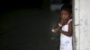 A young Rohingya migrant who arrived in Indonesia last week by boat eats a snack at a temporary shelter in Aceh Timur regency near Langsa in Indonesia's Aceh Province, May 26, 2015. 