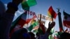 Sejumlah demonstran membawa poster bertuliskan "Hentikan Eksekusi di Iran" dalam aksi demonstrasi di Berlin, Jerman, pada 22 Oktober 2022. (Foto: AFP/John Macdougall
