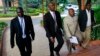 M23 rebel negotiators are seen heading into the final leg of negotiations with the Congolese government, in Kampala October 19, 2013. 