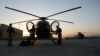 FILE - Afghan Air Force pilots perform preflight inspections prior to taking off with an all-Afghan crew for a combat mission, Sept. 27, 2015.
