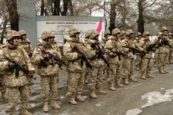 This handout photo taken and released by the Russian Defense Ministry January 12, 2022, shows Armenian soldiers CSTO soldiers guarding an infrastructure facility in Almaty, Kazakhstan.