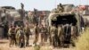 Israeli army soldiers deploy at a position near the border with Gaza in southern Israel on October 11, 2023.