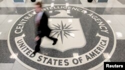 FILE - A man walks through the lobby of CIA headquarters in Langley, Virginia, Aug. 14, 2008. On Wednesday, the agency posted online instructions in Korean, Mandarin and Farsi detailing steps potential informants could safely take to contact U.S. intelligence officials.
