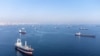 FILE PHOTO: Commercial vessels including vessels which are part of Black Sea grain deal wait to pass the Bosphorus strait off the shores of Yenikapi in Istanbul