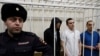 Адвокаты Игорь Сергунин, Алексей Липцер и Вадим Кобзев, представлявшие интересы российского оппозиционера Алексея Навального, на судебном заседании по обвинению в участии в экстремистской организации, Петушки, Россия, 17 января 2025 года. REUTERS/Юлия Морозова