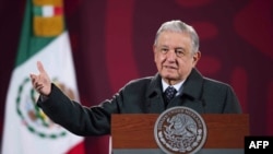 FILE - Mexican President Andres Manuel Lopez Obrador speaks during a press conference at the Palacio Nacional, in Mexico City, Jan. 17, 2022. On Feb. 7, 2022, Lopez Obrador denounced an upcoming auction of pre-Hispanic artifacts in France. (Handout photo 