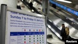 A notice about the impacts of a strike is placed at King's Cross station, as London Underground workers strike over pay and terms, in London, Britain, Jan. 7, 2024