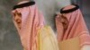 FILE - Saudi Foreign Minister Prince Saud Al Faisal, left, arrives with an unidentified aid for discussions with Catherine Ashton and the foreign ministers of EU and five other Arab countries.