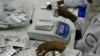 Employees inspect medication tablets produced at Azal Pharmaceutical Industries in Khartoum, Sudan on January 13, 2013. 