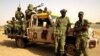 Soldiers from Burkina Faso stand guard at the airport, in Timbuktu, Mali, May 22, 2013.