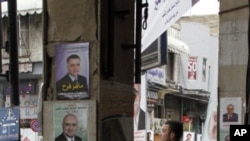 Hozirda parlamentda Assadning Baas partiyasi ustun
