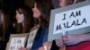 Girls from 33 Oklahoma communities hold signs following presentation of Reflectons of Hope Award in Oklahoma City, May 13, 2013.
