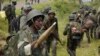 Congolese soldiers move to frontline positions as they advance against the M23 rebels in Kibumba, north of Goma October 27, 2013. REUTERS/Kenny Katombe (DEMOCRATIC REPUBLIC OF CONGO - Tags: MILITARY POLITICS CIVIL UNREST CONFLICT) - RTX14QPU