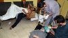 People, affected by what activists say is nerve gas, are treated at a hospital in the Duma neighborhood of Damascus August 21, 2013. 