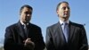 Republican gubernatorial candidate Rob Astorino (r) and Congressman Michael Grimm greet people as they exit a grocery store in the Staten Island borough of New York, Nov. 3, 2014. 