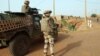 Troops of the French-led Serval Operation in Mali patrol an area in Gao, Oct.16, 2013.